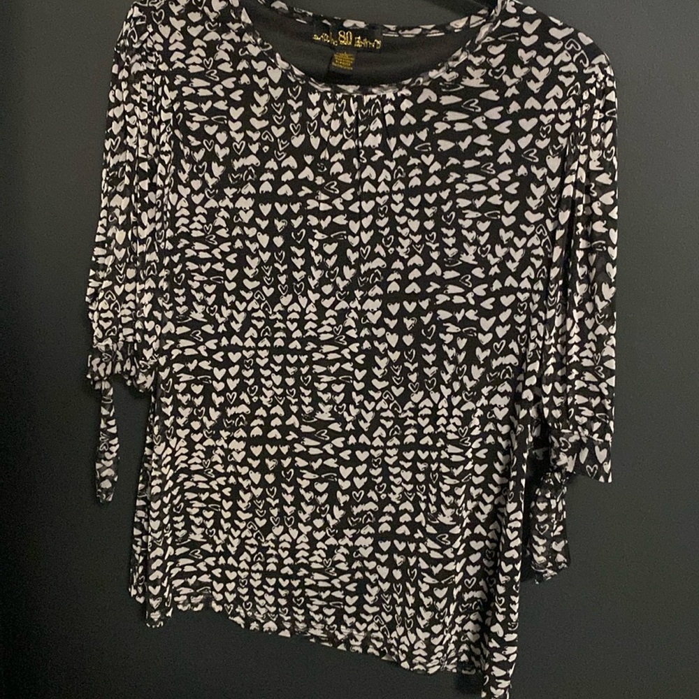 Love 🤍? You’ll love this hearts on black fully lined blouse/top